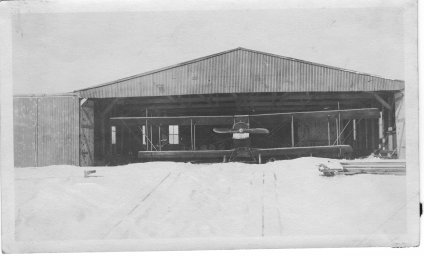 Biplane in a hangar at Bayside Airport, Huit's Cove, Hingham. (John Richardson Collection, Hingham Historical Society)